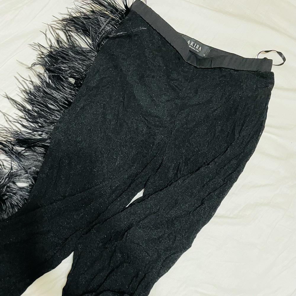 See through feathered black leggings.
